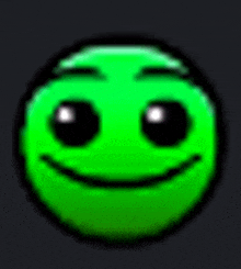 a green smiley face with black eyes and a smile on it .