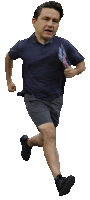 a man in a blue shirt and grey shorts is running with a magazine in his hand