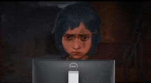 a cartoon girl is looking at a computer screen .