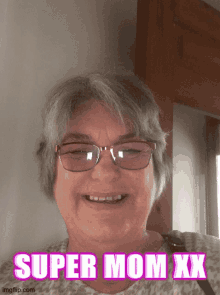 a woman wearing glasses and smiling with the words super mom xx below her