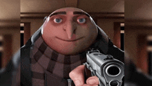 a despicable me character is holding a gun and smiling