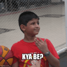 a young boy wearing a red shirt that says kya be on it