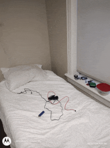 a bed with a motorola logo on the bottom left