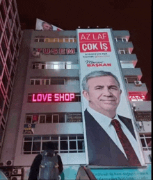 a large billboard on the side of a building that says az laf çok is