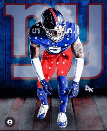 a new york giants football player stands in front of a giants logo