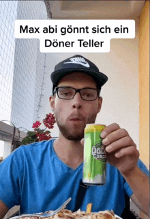 a man drinking a can of doner teller while wearing glasses