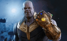 thanos is holding the infinity gauntlet in his hand