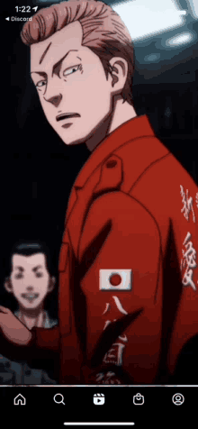 a man in a red jacket with a japanese flag on the sleeve