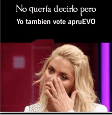 a woman covering her face with her hand and the words no queria decirlo pero yo tambien vote apruevo below her