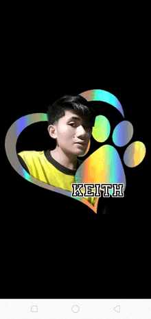 a young man in a yellow shirt with the name keith on it