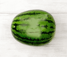 a watermelon with a person 's face on it