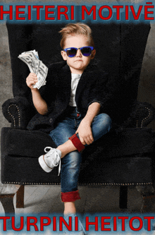 a young boy sitting in a chair holding a pile of money