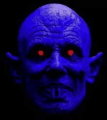 a close up of a blue monster with red eyes and a bald head .