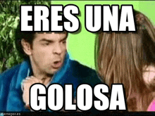 a man is talking to a girl with the words eres una golosa written on the screen