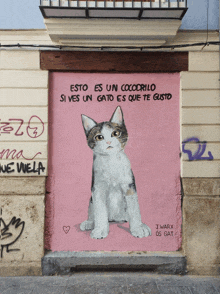 a painting of a cat with the words " esto es un cocodrilo si ves un gato es que te gusto " on it