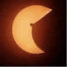 a partial eclipse of the sun with a crescent moon visible