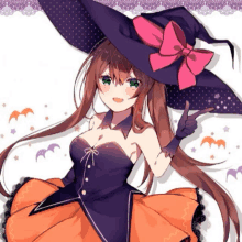 a girl is wearing a witch costume and giving a thumbs up sign .