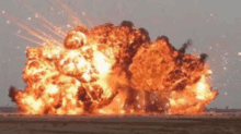 a large explosion in the middle of a desert .