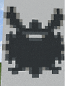 a pixel art drawing of a ghost on a white wall