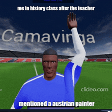 a man in a blue shirt is waving his hand in front of a soccer field with the words camavina on it