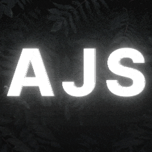 ajs is written in white letters on a dark background