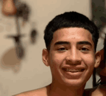 a man with braces on his teeth smiles for the camera