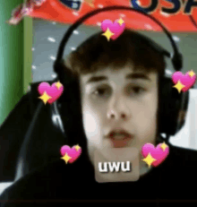 a young man wearing headphones with hearts around his head and a sticker that says uwu