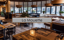 a restaurant with a sign that says la mouette on it