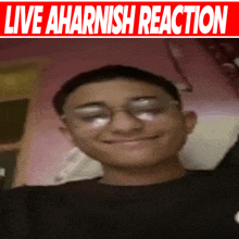 a picture of a boy with glasses and the words live aharnish reaction above him