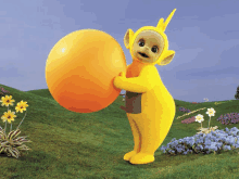 a yellow cartoon character is holding a large orange egg