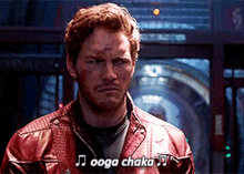 a man in a red leather jacket says ' ooga chaka ' on the screen