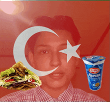 a man with a sandwich and a cup that says ayran