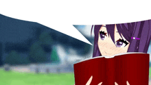 a girl with purple hair is reading a red book with a speech bubble above her head .