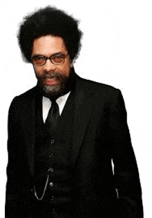 a man with an afro and a beard wearing a black suit and tie .