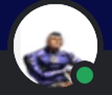 a blurry picture of a man in a purple suit with a green circle in the middle .