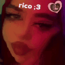 a close up of a woman 's face with the words rico : 3 written on her forehead