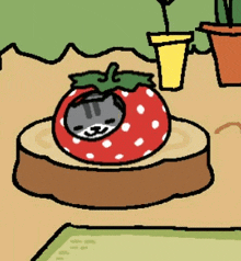 a cartoon cat is sleeping inside of a strawberry .