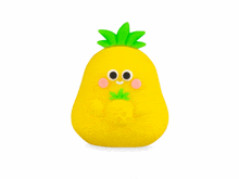 a yellow pineapple with green leaves and eyes