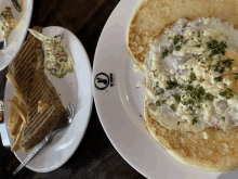 a white plate with a sandwich and an egg on it that says the coffee shop