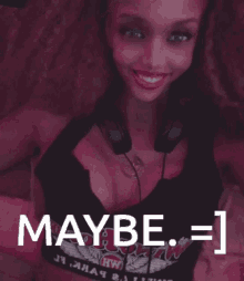 a woman wearing headphones and a shirt that says " maybe "