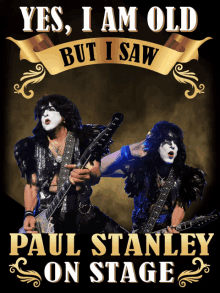 a poster for paul stanley on stage with two men playing guitars