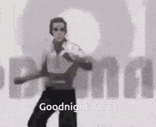 a man is dancing in front of a building with the words `` goodnight toast '' written on it .