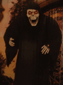 a grim reaper costume with a skeleton face and white hands