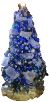 a christmas tree decorated in blue and silver with gifts underneath