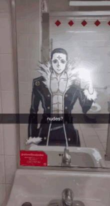 a man taking a selfie in front of a mirror with the words nudes on it