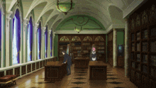 a man in a tuxedo stands in a library with a maid