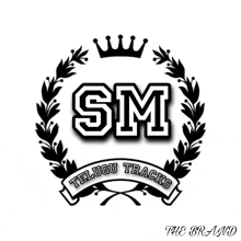 a logo for sm telugu tracks with a laurel wreath