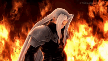 a video game character with long white hair standing in front of a fire .