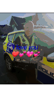 a police officer standing in front of a police car that says " i love you " on the side