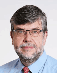 a man with glasses and a beard is wearing a blue shirt and a red tie